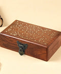 Retro Engraved Jewelry Box with heart-shaped bronze hasp lock and intricate floral design, shown closed on a wooden table.