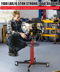 Heavy Duty 1100 Lbs Hydraulic Transmission Jack With 2 Stage Telescoping Arm And Massive Load Support For Smooth Engine Swaps On Any Car Or Light Truck In Your Home Garage Shop Today! in use for engine installation.