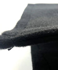 Close-up of black Gap Pad For Golf Simulator Frame And Screen Seam Filler That Keeps Gaps Out And Prevents Screen Damage, fabric texture.
