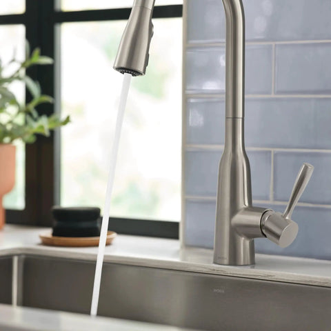 Top Shelf Stainless Steel Pull Down Kitchen Faucet Featuring One Handle High Arc Design With Fast Wash Power Boost And Smudge Resistant Matte Finish For Quick Cleanup And No Hassle Setup Plus Smooth Retractable Spray Hose Operation; water flowing gracefully from the faucet.