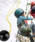 Arborist Retriever Ball Rope Friction Saver For Tree Work next to climbers, lightweight plastic climbing ball attached with rope.
