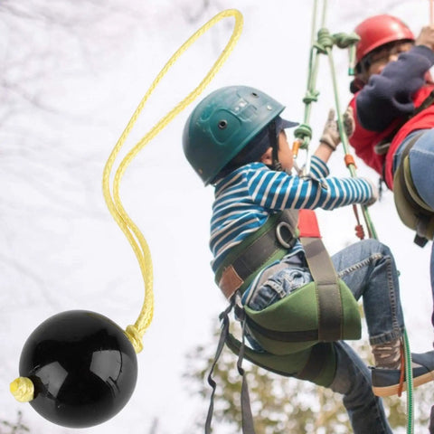 Arborist Retriever Ball Rope Friction Saver For Tree Work next to climbers, lightweight plastic climbing ball attached with rope.