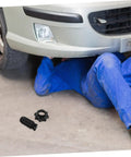 Mechanic under vehicle next to Beefy Spare Tire Hold Down Bolt For Easy Installation Durable Tire Fastening Hardware Compatible With Audi Models