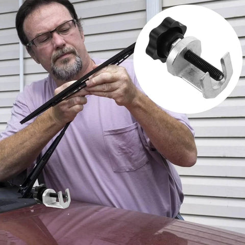 Man using Universal Windshield Wiper Arm Puller And Bearing Removal Tool For Vehicle Repair And Automotive Maintenance on car
