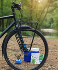 Gravel Bike Front Carrier Rack for Bikepackers High Front Cargo Mount on bike by river with camping gear