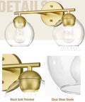 Gold Finish 2 Light Bathroom Vanity Light Over Mirror With Clear Glass Globe Shades, metal design visible, modern bath fixture