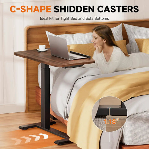 Woman using Tiltable Mobile Standing Desk With Wheels Pneumatic Height Adjustable Overbed Table For Laptop And Meals next to bed