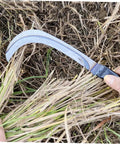Person using Two Pack Long Weeding Scythe Knife With Manganese Steel Multi Tool For Garden Weeding And Harvesting Hook Lightweight