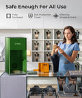 F1 Ultra 20W Fiber And Diode Dual Laser Engraver in a store setting with jewelry displays and a woman examining a necklace