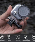 Hand holding Waterproof Dive Case For Go Ultra Thumb Camera, 164ft/50m Underwater Housing With Bracket, Scuba Shell
