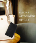 Full Grain Leather Coin Purse And Keychain Wallet With Slick Pull Zipper Closure attached to a handbag, stylish matte black finish.