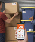 People organizing storage bins and boxes with Smart QR Code Labels For Storage Bins And Moving Boxes 40 Pack Scannable Stickers For Totes