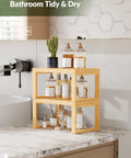 Heavy Duty Bamboo Cabinet Organizer Shelf Two Pack Stackable Kitchen Counter Rack Featuring Slatted Draining Surface To Air Out Dishes And Keep Counters Squeaky Clean on a marble countertop.