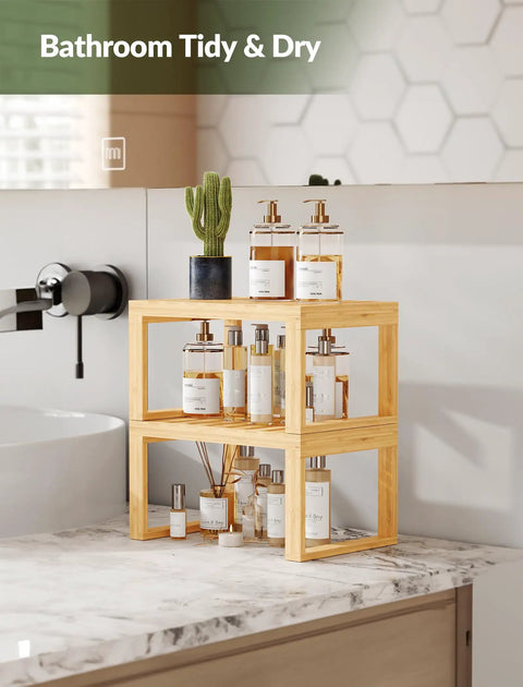 Heavy Duty Bamboo Cabinet Organizer Shelf Two Pack Stackable Kitchen Counter Rack Featuring Slatted Draining Surface To Air Out Dishes And Keep Counters Squeaky Clean on a marble countertop.