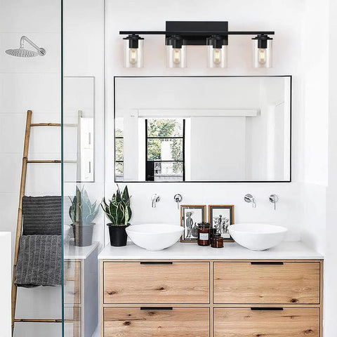 Dope Four Light Matte Black Vanity Lights With Clear Glass Shades in modern bathroom setting above double sink