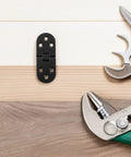 8 Piece Black Zinc Alloy Folding Table Flip Top Hinges With 180 Degree Round Edge Design on wood surface with tools