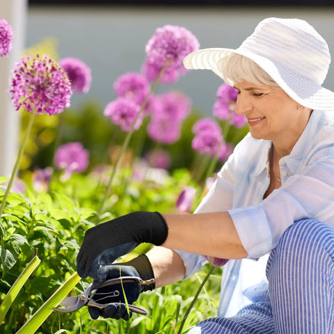 Woman gardening wearing nitrile coated work gloves with superior oil resistance and strong grip, ideal for everyday tasks.