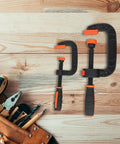 Two Piece Quick Release G Clamps Set For Woodworking With Plastic Jaw Bar Design, 2 inch and 3 inch sizes on wood background.