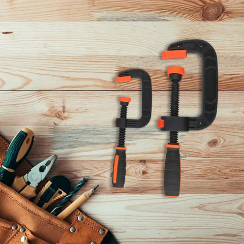 Two Piece Quick Release G Clamps Set For Woodworking With Plastic Jaw Bar Design, 2 inch and 3 inch sizes on wood background.