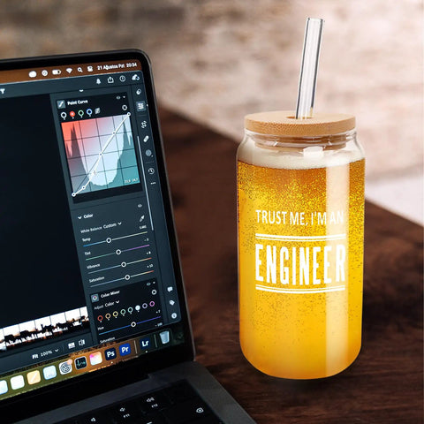 Engineer Mug For Him A Funny Gag Gift Durable Glass Cup filled with orange drink and lid next to laptop on desk