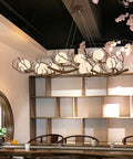 Branch Design Ceiling Pendant Light Vintage Moon Art Chandelier 9 Light Array Lowkey Stunning For Bedroom Restaurant Or Tea Room Decor Hits All The Right Vibes Durable Metal Frame in a dining area.