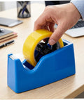Person placing yellow tape on Snag This Fresh 2-Pack Of 36Mm Plastic Tape Dispenser Core Replacement Spinner Wheels.