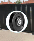 V Groove Wheel Caster for Inverted V Track with double bearings, steel AISI 1045, shown in front of a black gate.