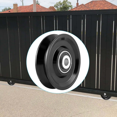 V Groove Wheel Caster for Inverted V Track with double bearings, steel AISI 1045, shown in front of a black gate.