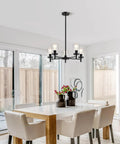 Dining room with Six Light Brushed Nickel Chandelier With Clear Glass Shades For Dining Room Kitchen Island Foyer And Hallway Modern Farmhouse Pendant Ceiling Light Fixture above table