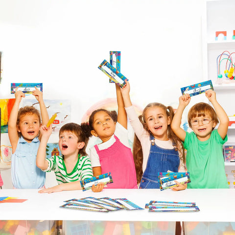 Children holding Sea Animal Themed Classroom Name Plates Pack Of 40 With Adhesive Dots Manuscript Alphabet Tags for Desks in classroom
