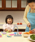 Straight Up Realistic Kitchen Faucet Toy For Kids Pretend Play Sink Accessories with vibrant colors on a kitchen table.