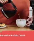 12 Cup Coffee Maker With Vortex Technology And Sneak A Cup Pause No Mess Pour Easy On Off Switch Non Drip Carafe Removable Filter Basket Delivers Rich Flavor And Clean Brew Every Time being used to pour coffee into a cup