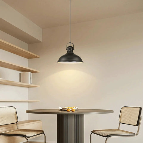 Three Pack Industrial Pendant Lights Black Metal Finish hanging above a round dining table with chairs in a modern rustic style room