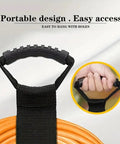 Versatile 17 Inch Adjustable Black Nylon Storage Strap with ergonomic handle holding orange garden hose, used for garage tools storage.