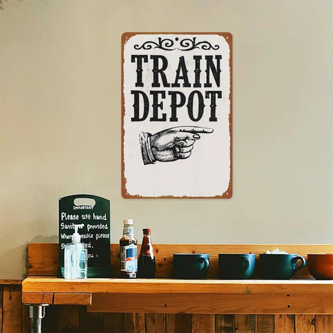 Train Depot Aluminum Wall Decor 12x8 Inch sign displayed above a shelf with cups and condiments, railroad station theme.