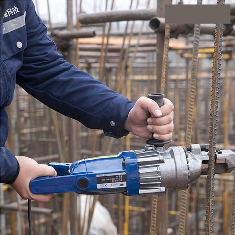 AOXHUGB Handheld Hydraulic Rebar Bender And Cutter Electric Shearing Machine being used to cut rebar on a construction site.