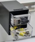 Two-Drawer Control Panel Organizer for DIN Rail Or Flat Surface With One-Click Toolless Install, holding fuses and USB drives.