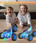 Kids playing with Lit Remote Control Drift Car With Strip Lights And Headlights 360 Degree Double Sided Rotating 4WD Stunt RC Truck For Boys And Girls Blue Best Birthday Gift For Young Adventurers, cars illuminated and in motion on floor