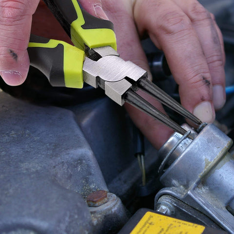 Beefy Four Piece 7 Inch Snap Ring Pliers Set in use removing retaining clips with durable steel construction and rust resistant finish