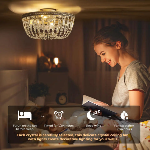 Woman reading under crystal ceiling fan with decorative lighting in bedroom.
