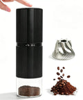 Portable Electric Coffee Grinder With Thirty Plus Burr Settings And Seven Precision Blades For Quick Even Grinds, black design with ground coffee.