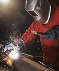 Welder using Low Hydrogen E7018 3/32 Inch Welding Rods 5 Pound Pack For Carbon Steel Arc Welding Electrodes on pipe
