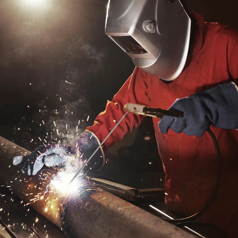 Welder using Low Hydrogen E7018 3/32 Inch Welding Rods 5 Pound Pack For Carbon Steel Arc Welding Electrodes on pipe