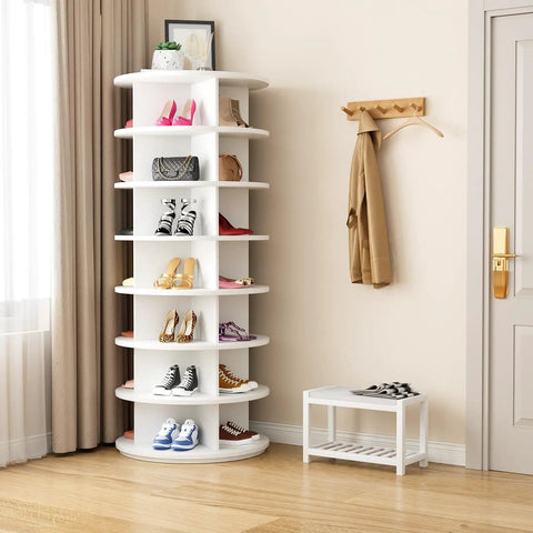 7 Tier Rotating Shoe Rack With 360 Degree Spin in white, holds 28-32 pairs, Lazy Susan style in a bedroom corner beside a window
