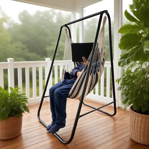 Indoor scene of weatherproof hammock chair stand with hanging swing chair included, rugged iron frame supports up to 450 lbs.