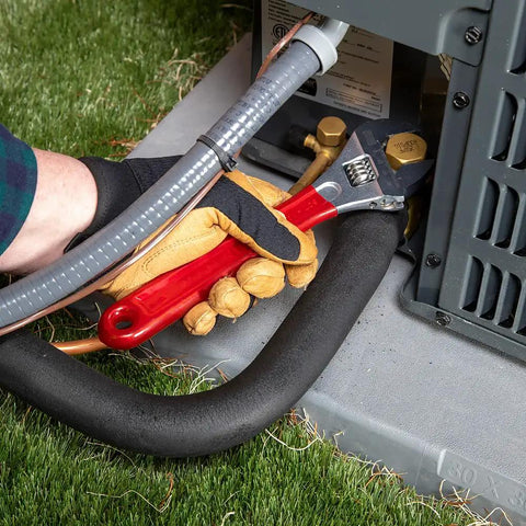 Using 10 inch adjustable drive wrench with extra capacity jaw built for tough jobs forged heat treated alloy steel chrome finish outdoors
