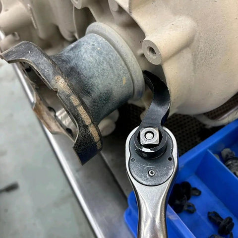 Ultra Compact Pry Bar Wrench Adapter Head For One Half Inch Drive Ratchets in use for quick prying and lifting car repair essentials