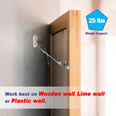 Heavy Duty Picture Hooks For Concrete Walls Zero Drilling Hassle 30 Pack installed on a wooden wall holding 25 lbs securely.