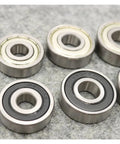 Heavy Duty Deep Groove Ball Bearing Set Sizes 6200 Through 6207 Featuring ZZ DDU RS Seals For Electric Motorcycles on gray background.