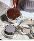 Boss Level 58mm Bottomless Portafilter With Genuine Black Walnut Handle For Breville Models, with ground coffee and filter.